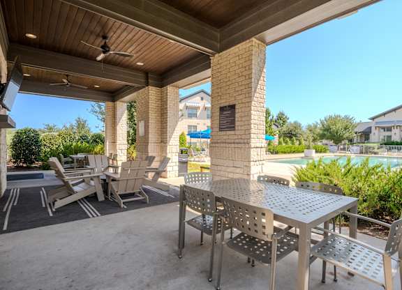 A patio with a table and chairs is shown.