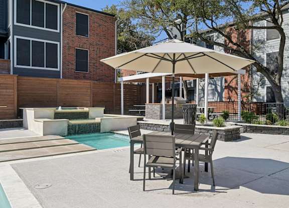 The Monet Apartments in Dallas, Texas Pool and Patio with Seating