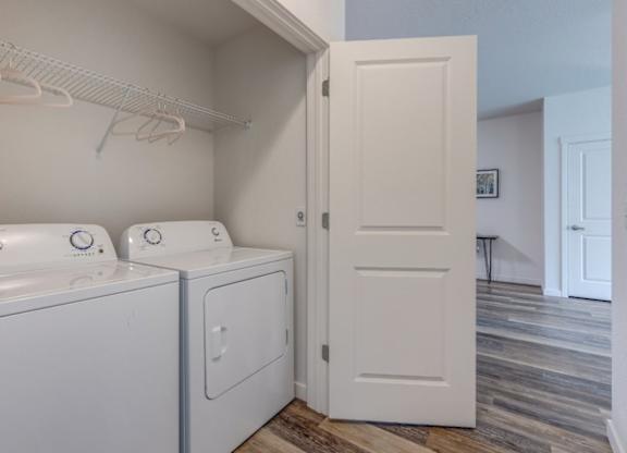 A white door is open to a hallway.