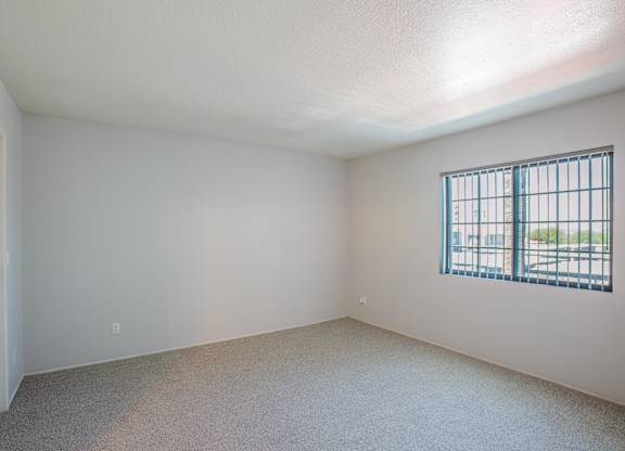 A room with a window and a door.
