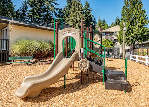 Community playground with slide at The Rosewood Apartments in Vancouver, Washington.