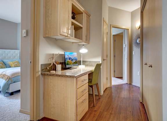 A room with a desk and a chair.