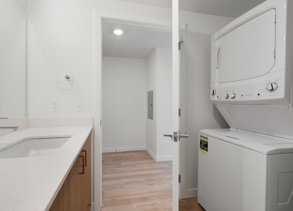 The Warren Apartments bathroom with washer and dryer