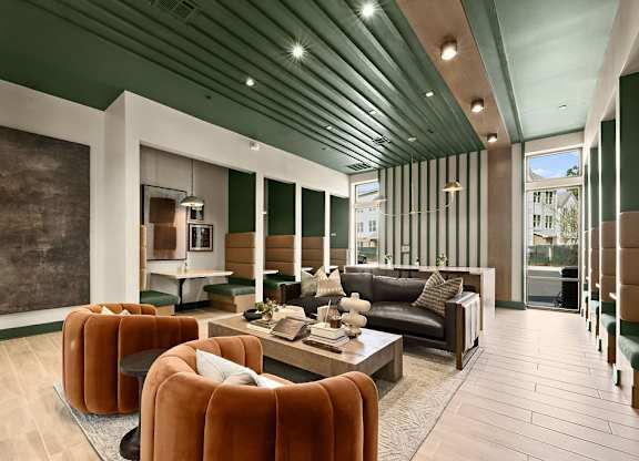 A modern living room with a wooden ceiling and a large brown sofa.