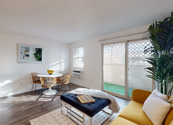 a living room with a and a table with two chairs