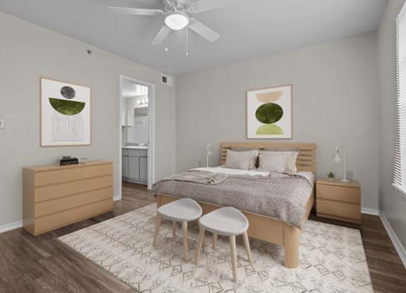 A bedroom with a bed, nightstand, and chair.