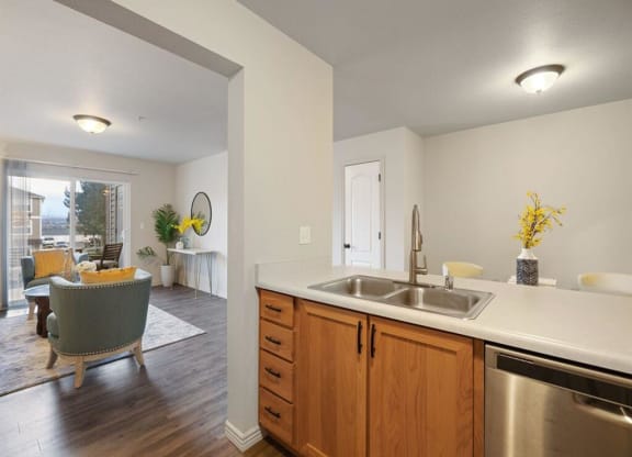 Kitchen with Dishwasher and View into Living Room at The Crossings at Chapel Hill, Pasco, WA