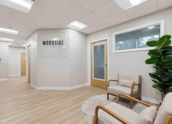 A room with a sign that says "Woodside" on the wall.