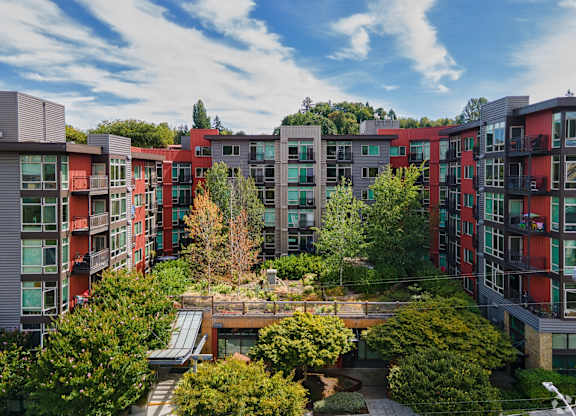 A modern apartment complex with a courtyard in the middle.
