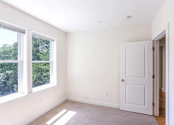 A room with a door and a window at Park87 Apartments, Massachusetts