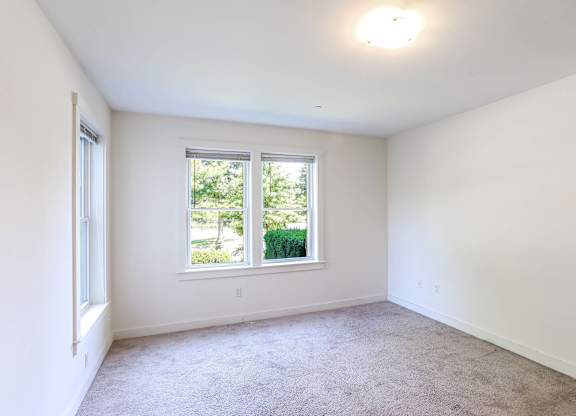 A room with a window and carpeted floor at Park87 Apartments, Massachusetts, 02138