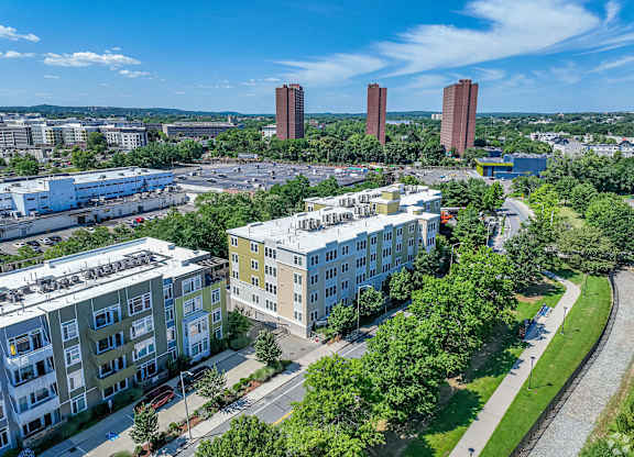 A view of a city with buildings, trees, and a clear sky at Park87 Apartments, Cambridge, MA
