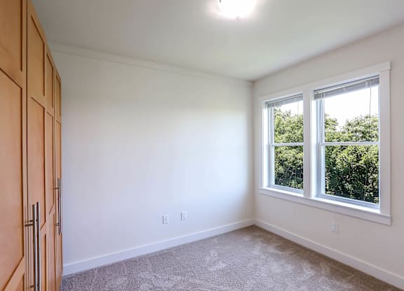 A room with a window and a door at Park87 Apartments, Massachusetts, 02138