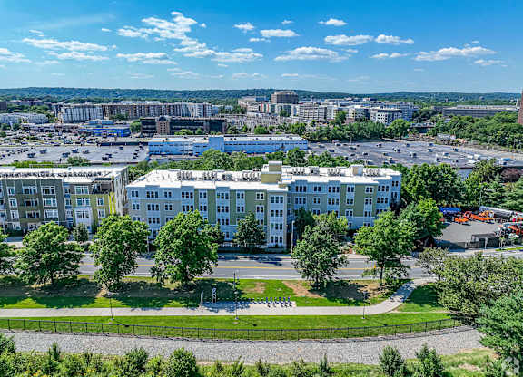 A large white building with a green lawn in front of it at Park87 Apartments, Massachusetts, 02138