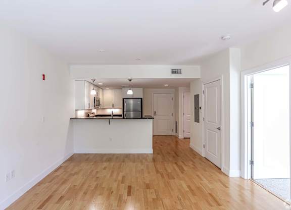 Open kitchen area into a large living room at 7 Cameron Apartments, Cambridge