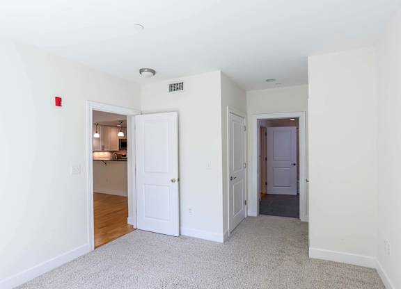 Spacious bedrooms with a carpeted floor at 7 Cameron Apartments, Cambridge 02140