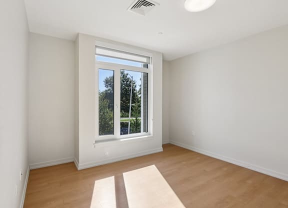 Bedroom with Large windows at Park77 Apartments, Cambridge, Massachusetts