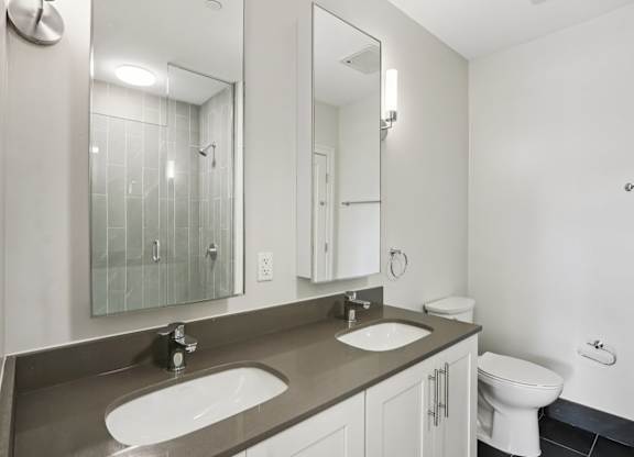 Bathroom with a toilet and sink at Park77 Apartments, Cambridge, MA