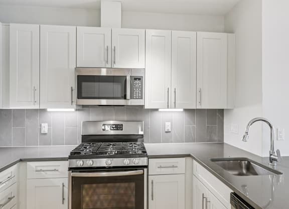 Kitchen with granite countertop and sink at Park77 Apartments, Cambridge, MA