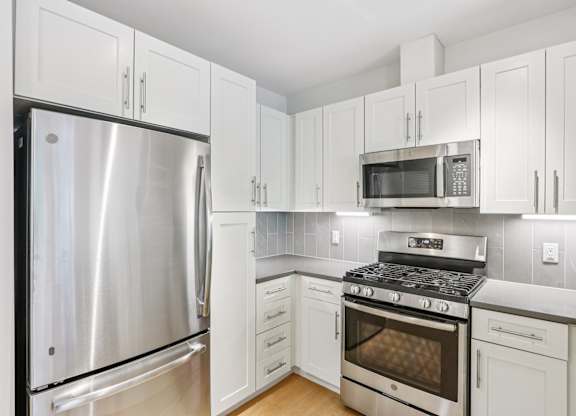 Kitchen with white cabinetry at Park77 Apartments, Massachusetts, 02138