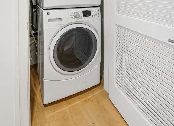 Front loading machines in small laundry room at Park77 Apartments, Massachusetts