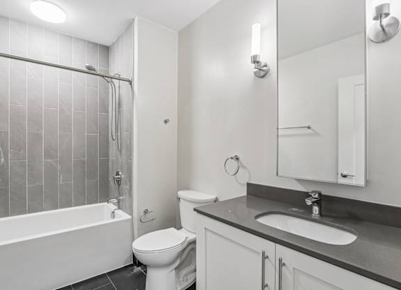 Bathroom with sink and bathtub at Park77 Apartments, Cambridge