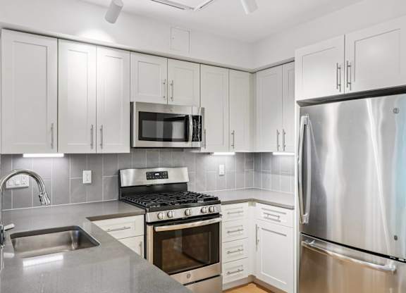Modern kitchen with refrigerator at Park77 Apartments, Cambridge, Massachusetts