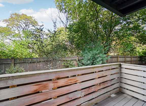 Wooden deck with a view of a backyard at Park77 Apartments, Cambridge