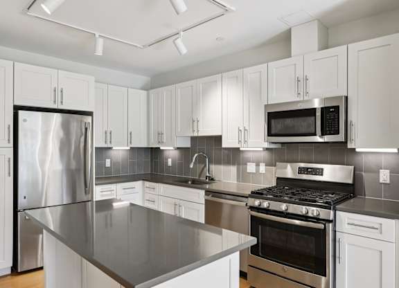Kitchen with white cabinets at Park77 Apartments, Cambridge, MA