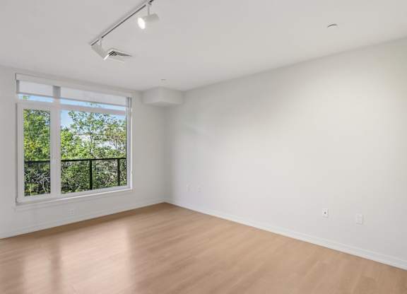 Unfurnished bedroom with sliding door window at Park77 Apartments, Massachusetts, 02138