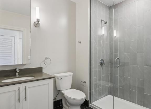 Bathroom with a shower and toilet at Park77 Apartments, Massachusetts