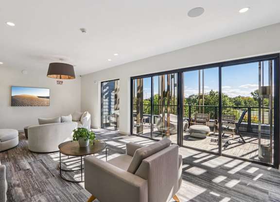 Gorgeous living room with attached patio at Park77 Apartments, Cambridge, Massachusetts, 02138