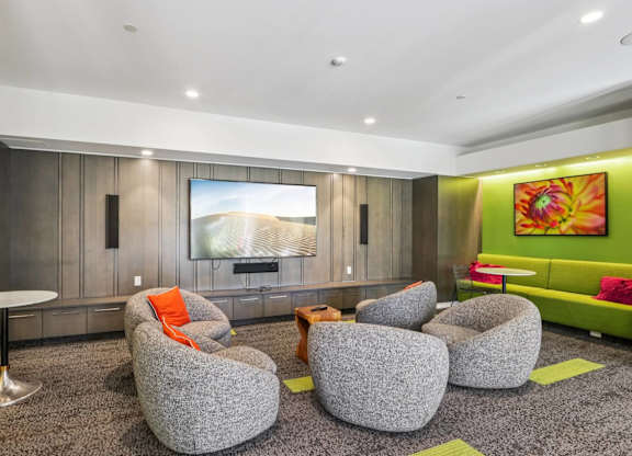 Common living room with grey chairs at Park77 Apartments, Massachusetts, 02138