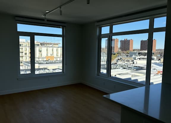 Empty room with a view of the cityscape outside at 605 Concord at Fresh Pond Apartments, Cambridge, MA