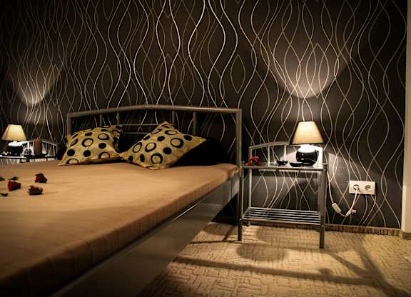 bedroom with black accent wall