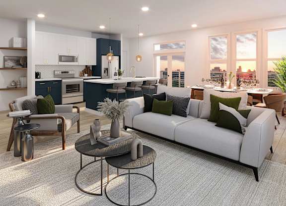 A modern living room with a white sofa and a coffee table.