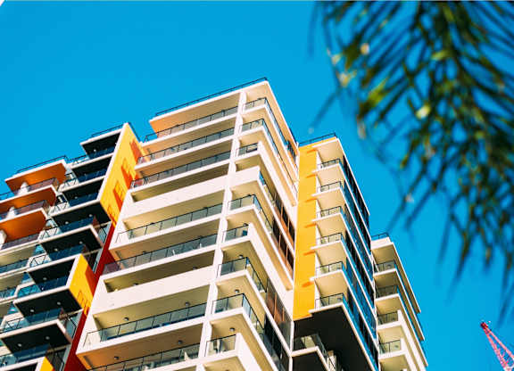 a tall building with a blue sky in the background