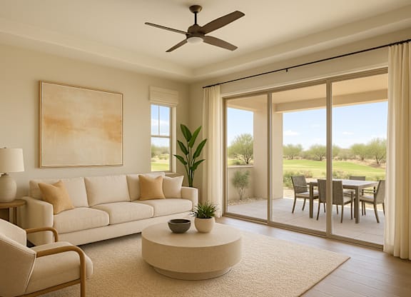 A living room with a white sofa, a round coffee table, and a painting on the wall.
