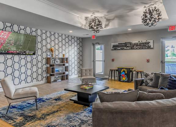 a living room with couches and chairs and a coffee table