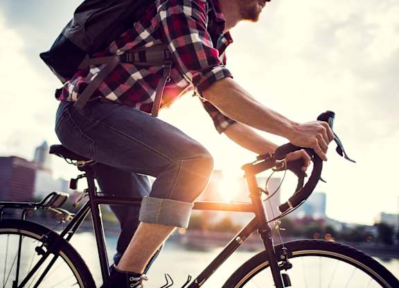 guy riding bike in city