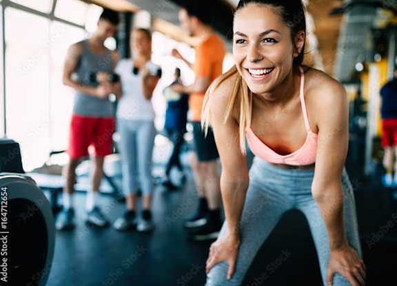 a group of people working out in a gym