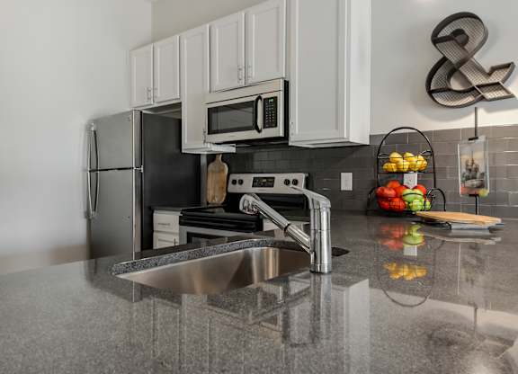 a kitchen with stainless steel appliances and a sink