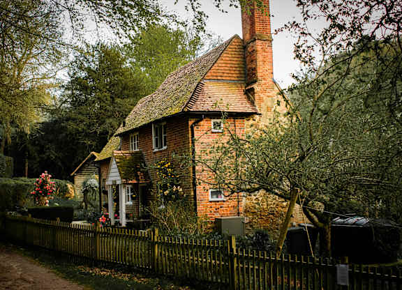 A house with a red brick chimney and a white door.