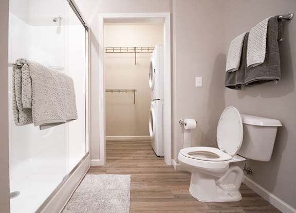 Hardwood floor bathroom  with walk-in closet