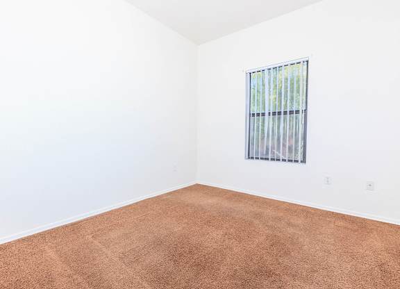 Room with Carpeted Floor at San Martin Apartments, Glendale, 85301