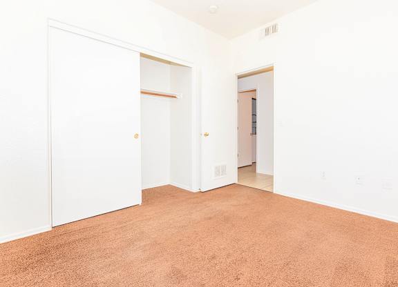 Room with Brown Carpeted Floor at San Martin Apartments, Glendale, Arizona