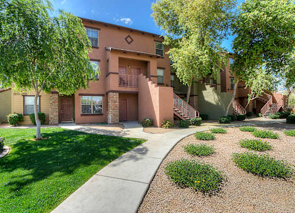 Building with brown facade and lawn around it at San Angelin Apartments, Mesa, AZ, 85206