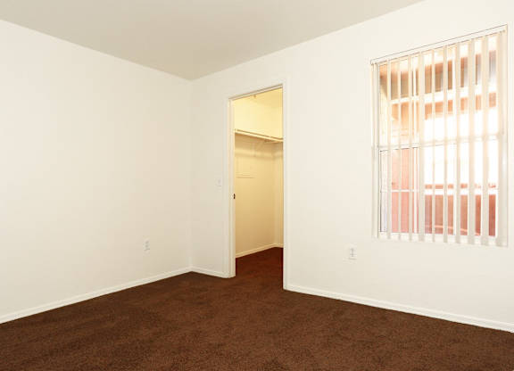 Room with attached closet at San Bellino Apartments, Glendale, AZ, 85303