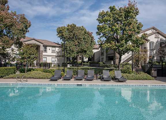 Stoneridge apartments, Roseville, CA, pool and lounge chairs
