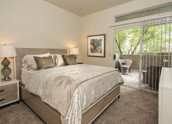 Model Bedroom With Access To Patio at Autumn Oaks Apartments, Roseville